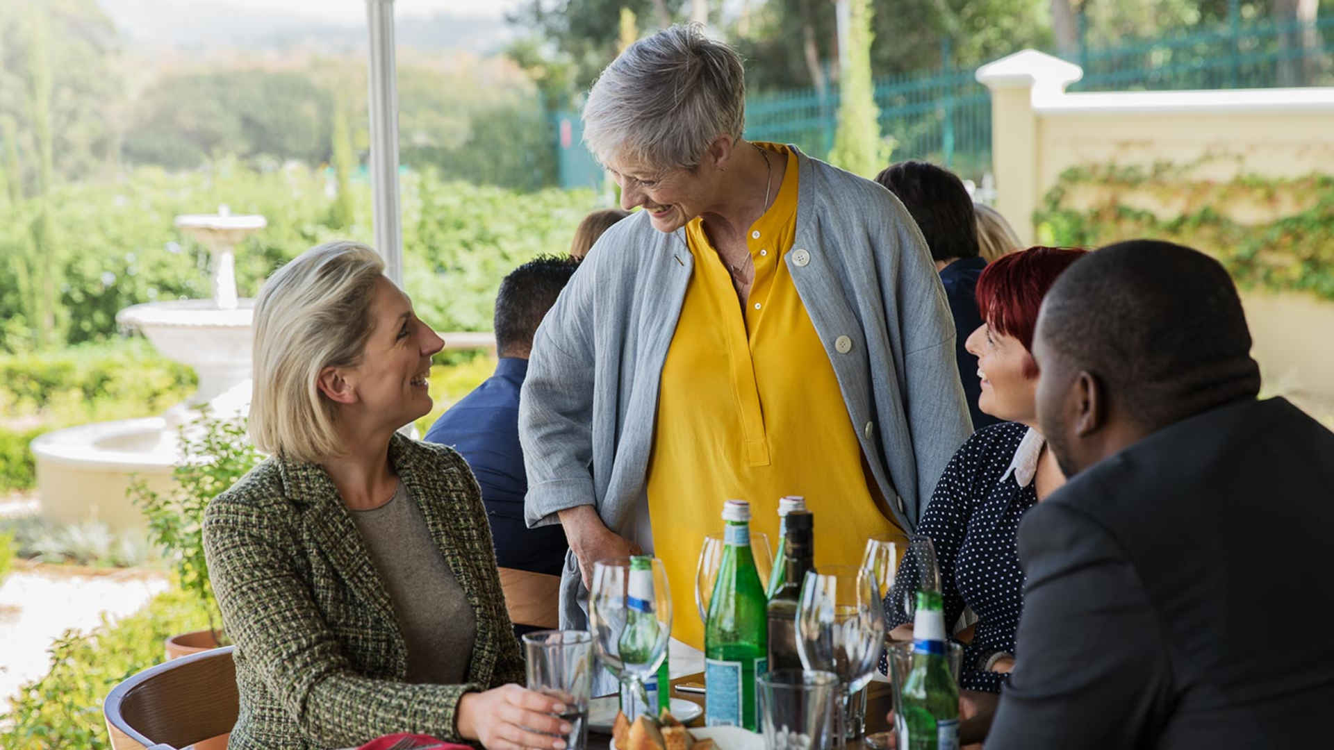 Woman talking to guests