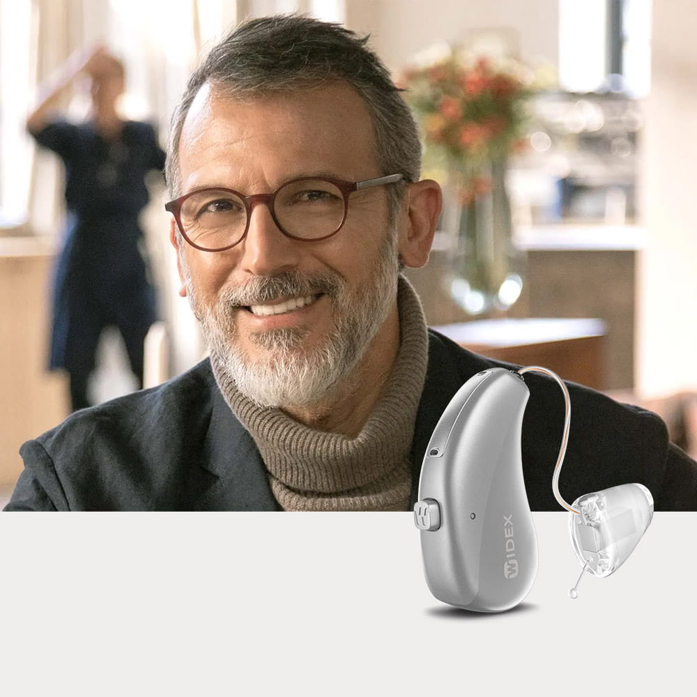 Widex Moment Sheer sRIC - man with sRIC hearing aids smiling