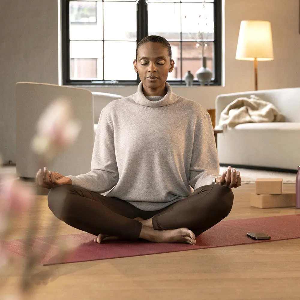 Widex Moment Sheer - woman lotus position